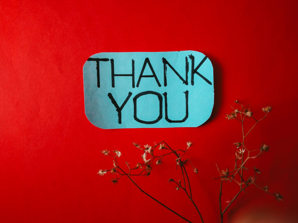 roter Hintergrund mit Thank you Schild